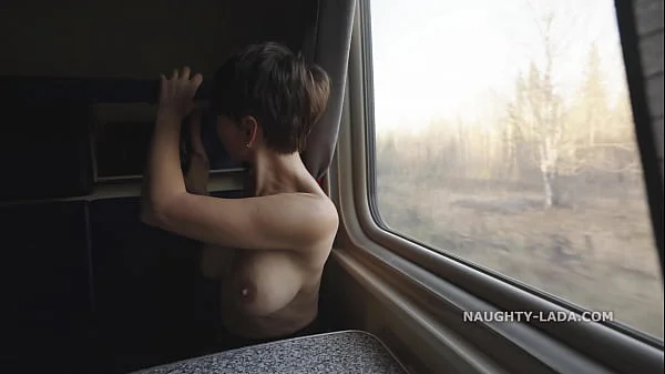 Naked fellow traveler with a dildo.