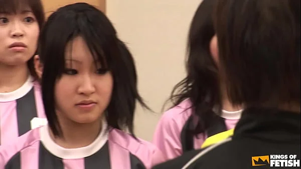 Japanese female team listen and take a lesson from their coach