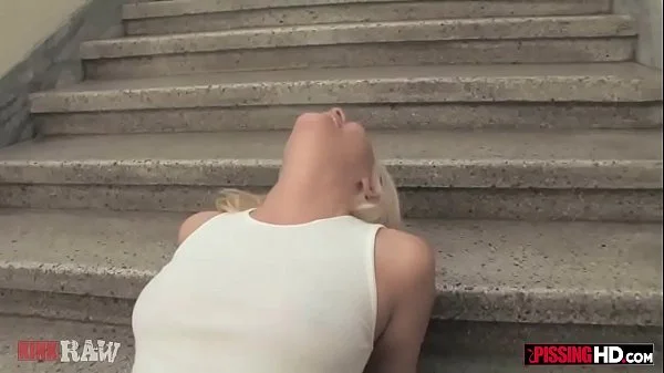 Sexy blonde has her body covered in pee by multiple men