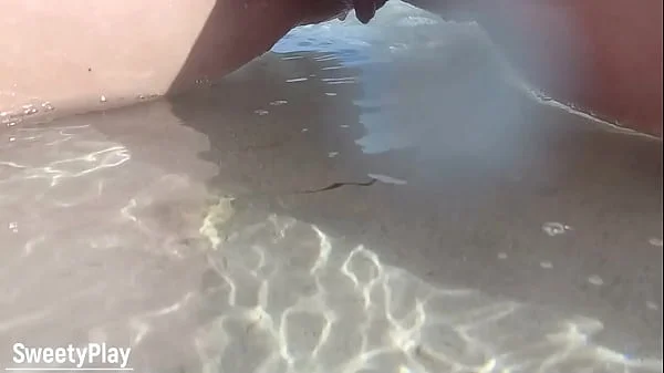 Shaved pussy peeing on public beach