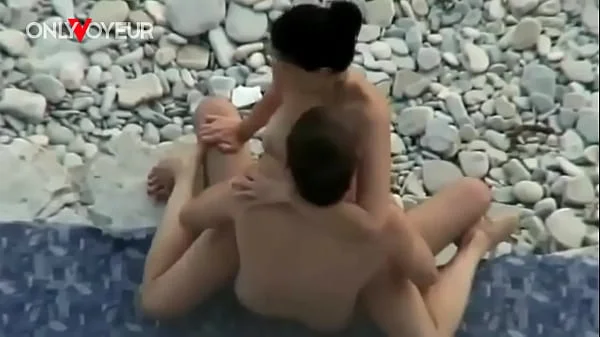 Busty amateur nudist swimming naked and getting her pussy licked and fucked on a public beach