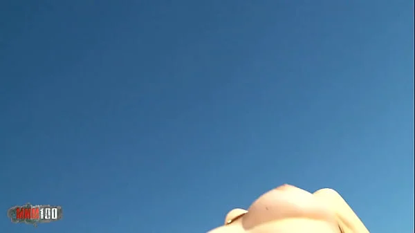 Pretty teen brunette Natty Mellow stripping on the beach