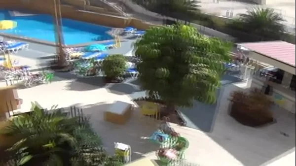 Christie gets oiled up and fucks herself on vacation balcony