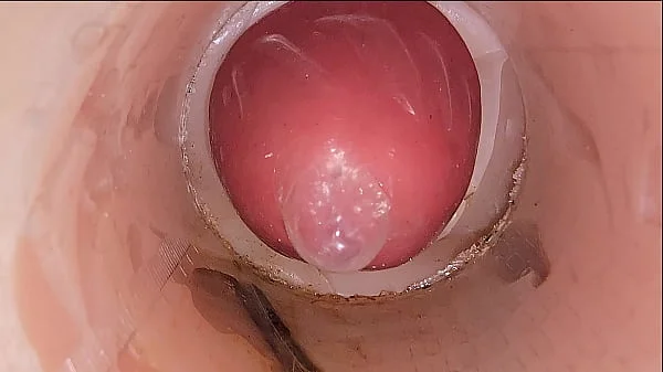 The camera in the deep pussy records a huge ejaculation of sperm into the condom