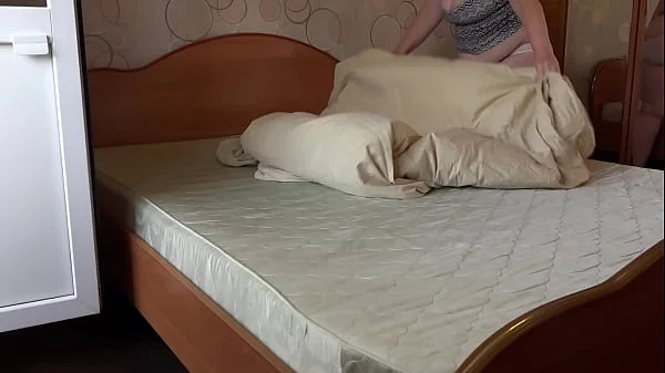 A mature wife masturbates in white panties while cleaning, and a home camera watches her. Big ass, hairy pussy, gorgeous tits and an appetizing figure behind the scenes.