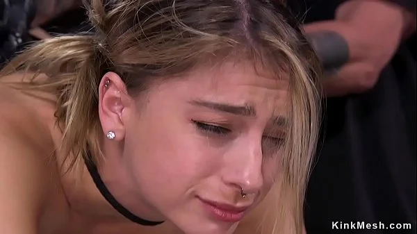 Blonde strapped in metal device bondage