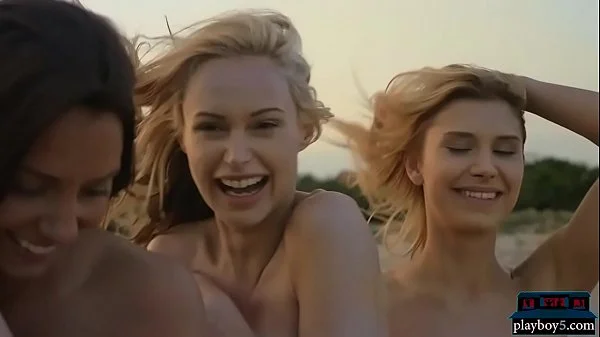 Four lesbian girlfriends enjoy each other on the beach