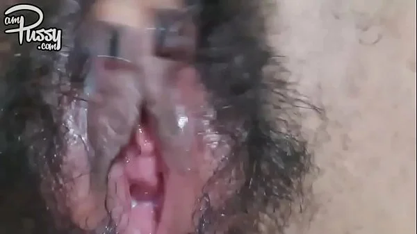 Extreme close-up hairy pussy masturbation