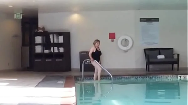 Sexy Grandma is Sexy at 66 in a black swimsuit