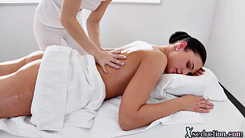 Asian masseuse scissoring her client