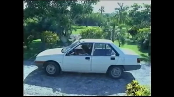 Busty natural 90's model changes bras and goes to the beach