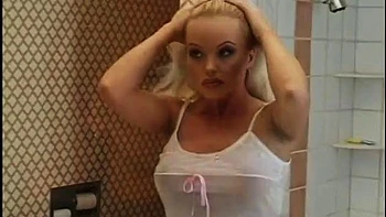 Juicy blonde with big natural tits courts Madam Knuckle in the shower before handsome man pays her a visit