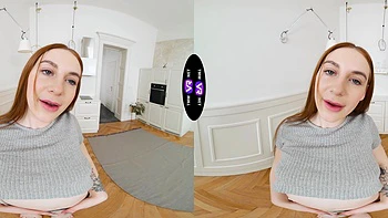 A sexy girl with long hair plays with her pussy in shorts