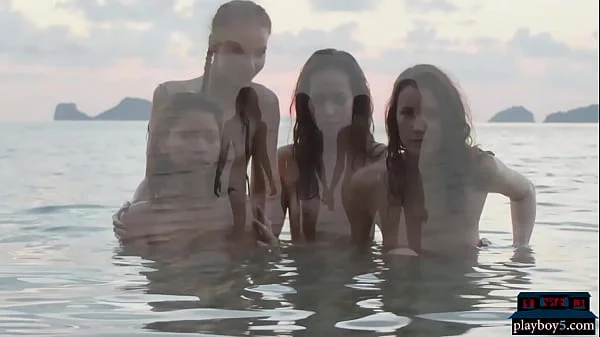 Four pretty lesbian girlfriends get naked on the beach