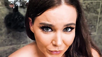 Brunette woman has sex with her boyfriend in the bathroom, showcasing big tits.