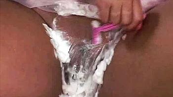 Big-boobed hottie Kerry Marie nicely plays with her shaved pussy