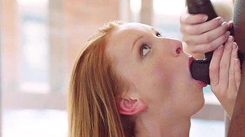 A pale girl has sex with a black guy with a big cock in close-up