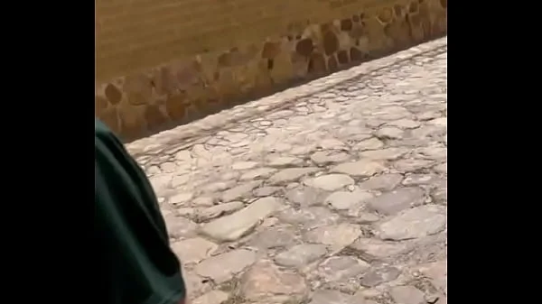 Two lesbians touch each other to orgasm on the corner of a town trying to avoid being seen by anyone