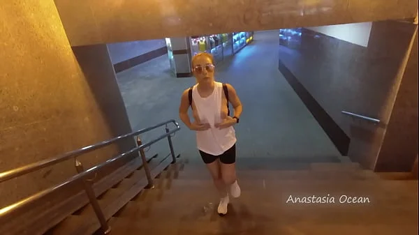 A girl rides a public bus with bare breasts