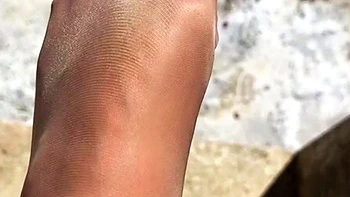 MILF in fishnet enjoys foot fetish